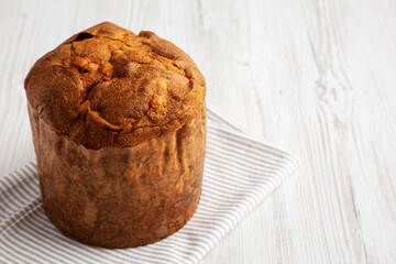 Homemade Italian Panettone with Raisins and Large Pieces of Candied Fruit, side view. Space for text.