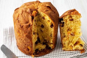 Homemade Italian Panettone with Raisins and Large Pieces of Candied Fruit, side view.