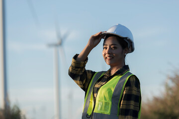 worker in field. silhouette of female with a windmill. silhouette of a person with a windmill
