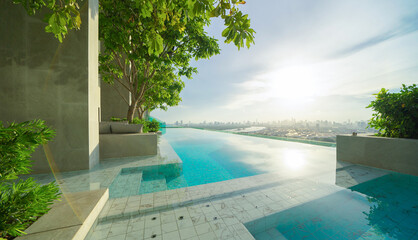 Naklejka na ściany i meble Swimming pool on rooftop of hotel apartment building in Bangkok downtown skyline, urban city view. Relaxing in summer season in travel holiday vacation concept. Recreation lifestyle.