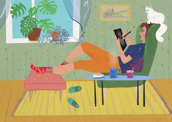 Woman in a cozy room sits on an armchair with a tablet. Remote work, work at home as an illustrator. Cat on the armchair, window, cat, tea