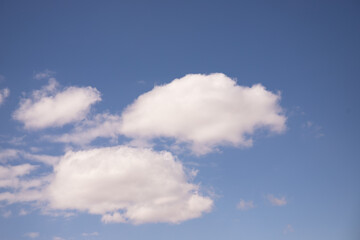 Obraz premium White clouds in the blue sky.