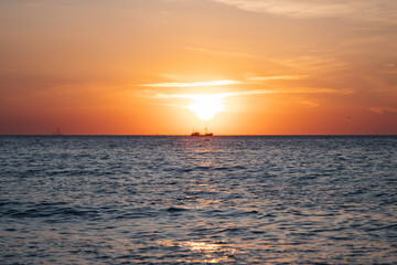 Boat sailing during sunset