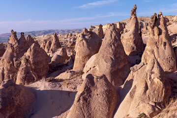 Unreal world of Cappadocia. Amazing hills in Cappadocia mountains. Traveling concept background