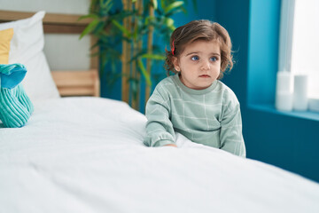 Adorable hispanic girl standing with relaxed expression at bedroom