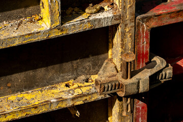 Construction site. An industrial facility under construction. Concrete formwork with a folding mechanism on construction site. The clamp connects the formwork panels close-up.