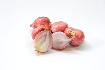 Shallots onion cut in half on white background.