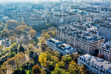 Panoramic aerial view of Paris from Eiffel Tower. Beautiful view of Paris skyline with typical parisian facades in the center.