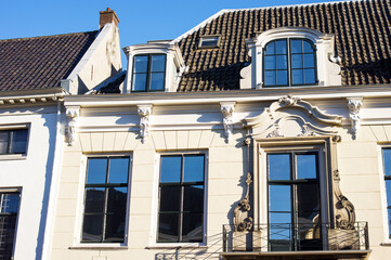 Closeup of the facade with windows and a balcony of an old luxury villa in Utrecht in the Netherlands