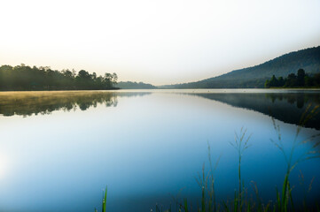 Huay Tueng Thao Lake in the early morning, the lake offers beautiful scenery, fresh air and steam rising from the surface