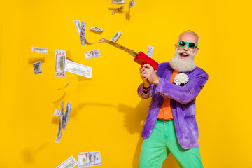 Photo of crazy retired pensioner grandfather win million usd dollars shoot money gun isolated on...