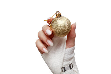 A woman's hand in a bandage headband holds a Christmas ball decoration. The concept of Injuries for Christmas and Christmas holidays, injuries in winter, hand injury, wrist injury