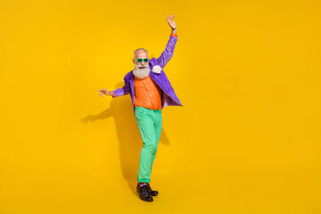 Full length photo of positive cheerful man wear purple velvet jacket sliding legs dancing...