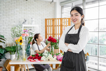 group of female florists Asians are arranging flowers for customers who come to order them for various ceremonies such as weddings, Valentine's Day or to give to loved ones.