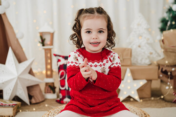 smiling little girl at home during christmas time