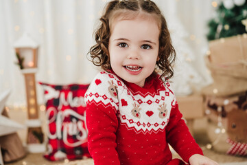 cute little girl at home during christmas time