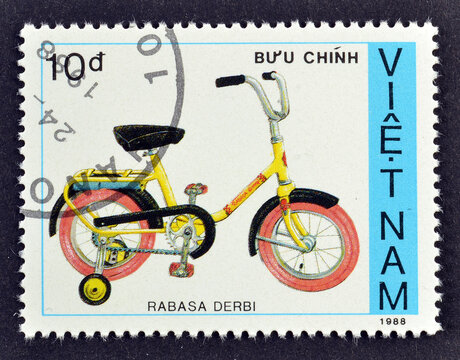 Cancelled postage stamp printed by Vietnam, that shows Rabasa Derbi bicycle, circa 1988.