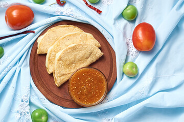 Traditional Mexican food, corn tortilla quesadillas, stuffed with cheese.