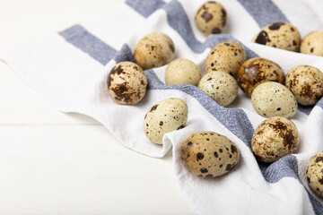 Quail eggs on a white wooden background. Healthy food. Diet. top view. free space.