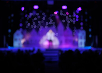 Fototapeta na wymiar Texture blur and defocus, background for design. Stage light at a concert show in theater.