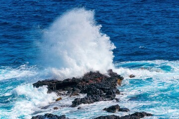 waves crashing on rocks