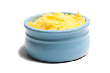 Ghee in a butter dish isolate on a white background
