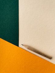 Stationery on office table. Wooden sharpen pencil on the colourful background
