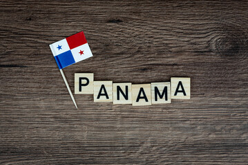 Fototapeta na wymiar Panama - wooden word with panama flag (wooden letters, wooden sign)