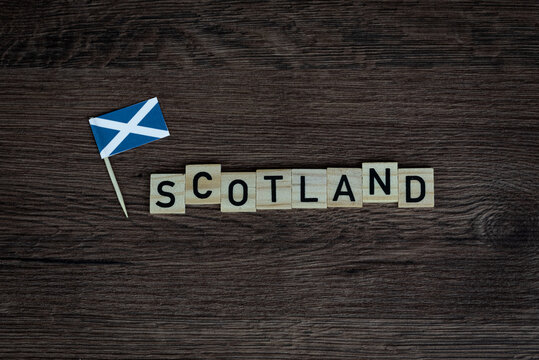 Scotland - wooden word with scottish flag (wooden letters, wooden sign)