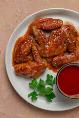 Chicken wings, with barbecue sauce, with tomato sauce, fast food, no people,