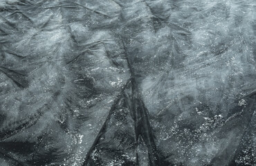 Frosty patterns on the ice . crystal structure. Winter fairy background