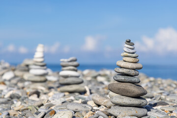 Fototapeta na wymiar Stack of stones on the sea beach