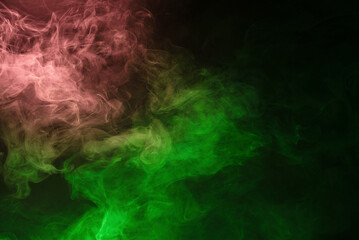 Obraz na płótnie Canvas Green and pink steam on a black background.