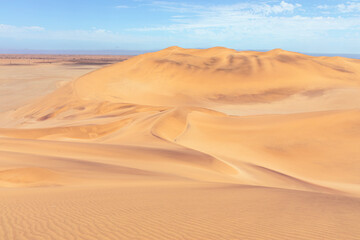 Fototapeta na wymiar Namibia Desert. Aerial View Sand Dunes near Walvis Bay. Skeleton Coast. Namibia. Africa.