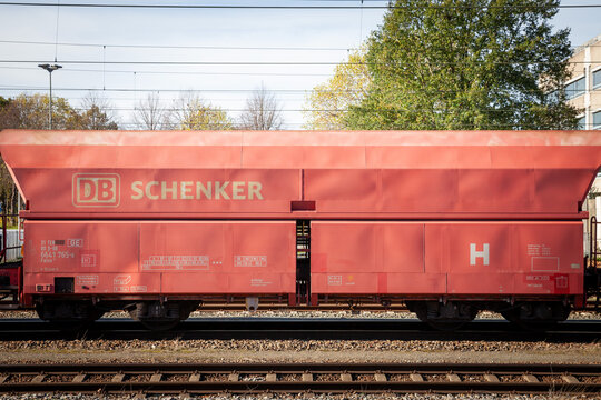 SITTARD, NETHERLANDS - NOVEMBER 10, 2022: DB Schenker logo on a freight cargo wagon in a train in Sittard. DB Schenker, part of Deutsche bahn, is German Logistics company providing cargo services...