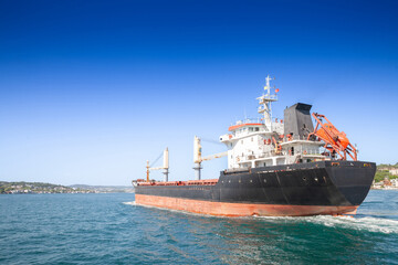 oil tanker carrying gas and petroleum cruising on the bosphorus strait in istanbul for an international cargo mission. The bosporus strait has a special naviation and maritime status....