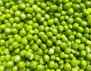fresh green peas peeled as a background texture, closeup