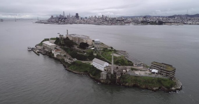 Aerial view of Alcatraz island in the San Francisco Bay. USA. The most famous Alcatraz Prison, Jail. Sightseeing Place. San Francisco City in Background