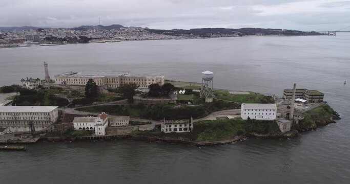 Aerial view of Alcatraz island in the San Francisco Bay. USA. The most famous Alcatraz Prison, Jail. Sightseeing Place. Golden Gate Bridge In Background