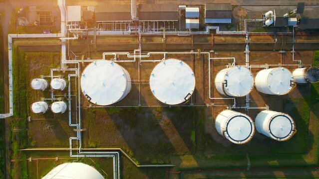 Oil station gasoline tank on the ground in large oil distribution center. oil is a commodity that is exported all over the world. energy and Fossil Fuel concept. energy and fuel for export industry.
