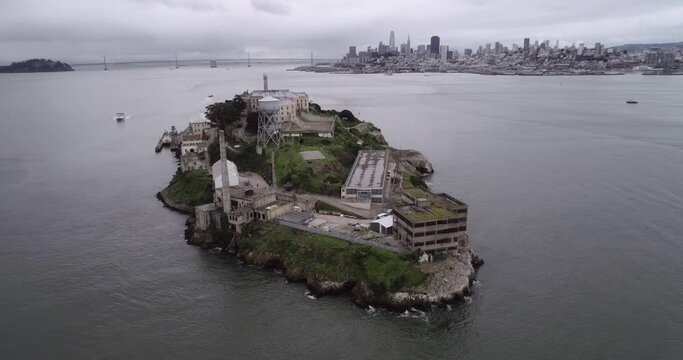 Aerial view of Alcatraz island in the San Francisco Bay. USA. The most famous Alcatraz Prison, Jail. Sightseeing Place. San Francisco Cityscape in Background.