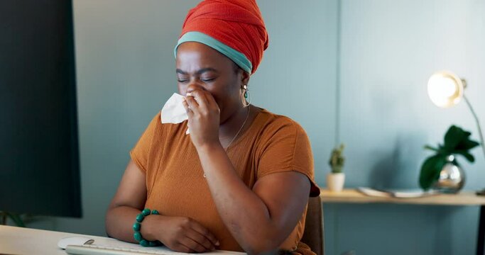 Flu, sick and sneeze business woman blowing nose at night with tissues in office for illness, sinus and allergy risk. Sneezing, allergies and black female working late on computer with health problem