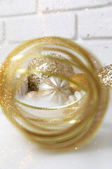 New Year and Christmas background. Christmas balls of golden and white color on a white background. Front view