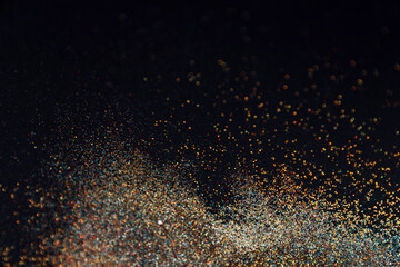 Fototapeta premium Abstract background of blurred colourful glitter for design. Lights bokeh dis focus. Christmas background, copy space