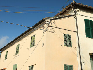 Residential building against blue sky on sunny day