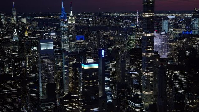 Beautiful Aerial View of Famous Buildings in Midtown Manhattan. Hudson River and New Jersey Skyline in the Background. High Quality Footage Shot from Helicopter. New York City, United States. 