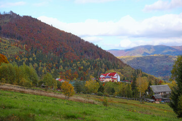 Picturesque view of houses and trees in mountains