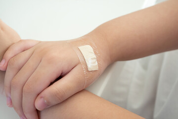 waterproof adhesive plaster on little kid hand