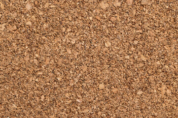 Untreated cork panel, close-up of the coarse texture of rough grained cork oak, Quercus suber. Used as decorative panels and veneers for coaster, bulletin boards, floor and wall tiles. Macro photo.