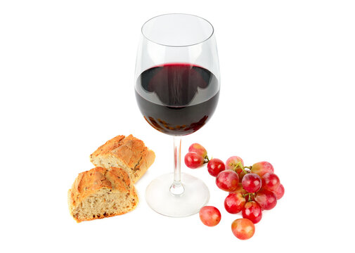 A glass of red wine , bunch of grapes and baguette isolated on a whit.